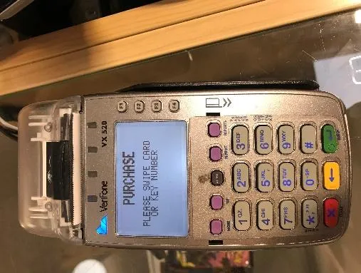 Swiping the gift card for a purchase