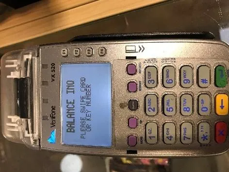 Swiping the gift card for a balance inquiry